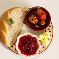 Bread with butter and strawberry jam