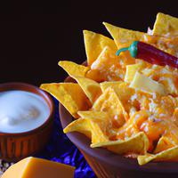 Cheese covered tortilla chips
