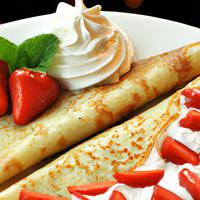 Crepes with strawberries and whipped cream