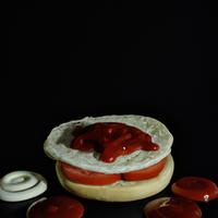 English muffin with cream cheese and ketchup