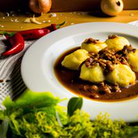 Potato dumplings with minced meat sauce