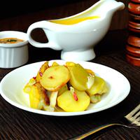 Potato slices in yellow sauce