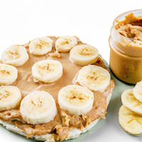 Rice cake with peanut butter and banana slices