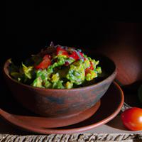 Salad with guacamole and tomato