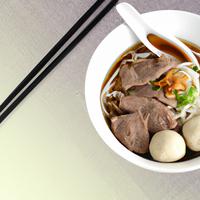 Sliced beef noodle with beef balls and beef tendon soup