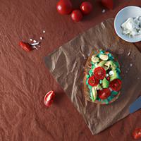 Smashed avocado with tomato and fetta on sourdough