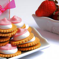 Strawberry cookies with vanilla frosting and wafer