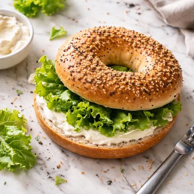 Bagel with cream cheese and lettuce