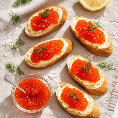 Baguette slices with red caviar