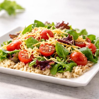 Brown rice cherry tomatoes spring mix mexican cheese