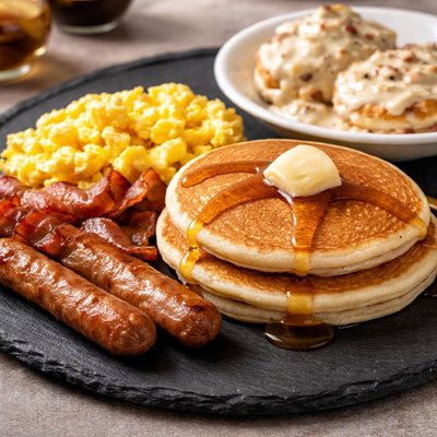 Denny grand slam with pancakes and a side of biscuits and gravey