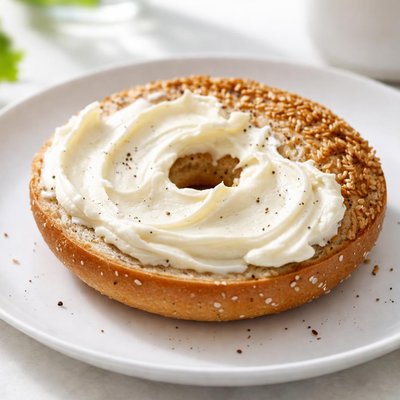 Half a bagel with cream cheese