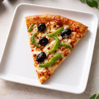 Slice of pizza with olives and green peppers