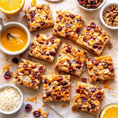 Image of Cranberry Pecan Macadamia Coconut Bars with Orange Glaze