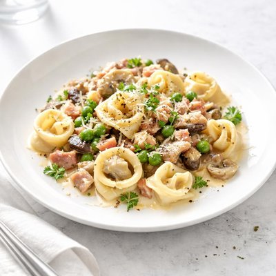 Image of Creamy Tortellini with Ham Mushrooms and Peas