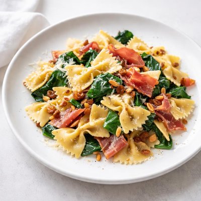 Image of Farfalle with Prosciutto Spinach Pine Nuts and Raisins