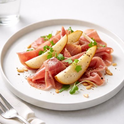 Image of Shavings of Country Ham with Parmesan Pears and Pine Nuts