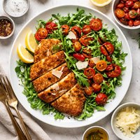 Chicken Milanese with Slow Roasted Cherry Tomatoes and Arugula