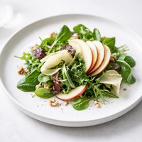 Leafy Salad with Crisp Apple Slices and Parmesan Cheese Curls