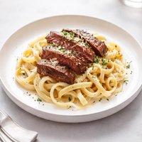 Marinated Steak Fettuccine with Smoked Mozzarella Sauce