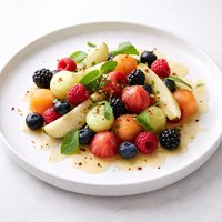Melon Berry and Pear Salad with Cayenne Lemon Mint Syrup