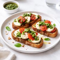 Mozzarella Tomato Pesto Bruschette