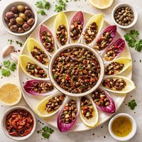 Olive and Sun Dried Tomato Tapenade with Endive Leaves