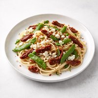 Pasta with Sun Dried Tomatoes Snap Peas and Feta