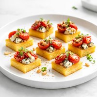 Polenta Bites with Blue Cheese Tomatoes and Pine Nuts