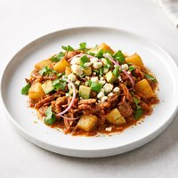 Pork Tinga with Potatoes Avocado and Fresh Cheese