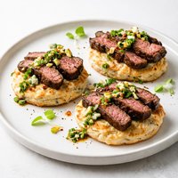 Sliced Grilled Steak on Blue Cheese Biscuits