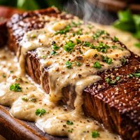Smothered Flat Iron Steak in a Parmesan Pepper Sauce