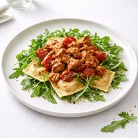 Spicy Chicken Rustica on Ravioli and Arugula