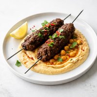 Spicy Minced Beef Kebabs with Hot Chickpea Puree