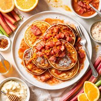 Spicy Orange Ricotta Pancakes Drizzled with Rhubarb Syrup