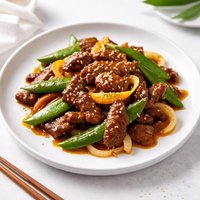 Tangerine Stir Fried Beef with Onions and Snow Peas