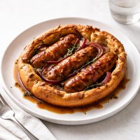 Toad in the Hole with Red Onions and Thyme Batter