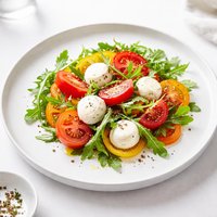 Tomato and Fresh Mozzarella Salad with Arugula Peppers