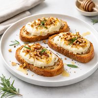 Warm Goat Cheese Toasts with Honey Rosemary and Walnuts