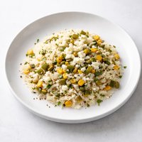 White Rice Pilaf with Corn Roasted Chiles and Fresh Cheese